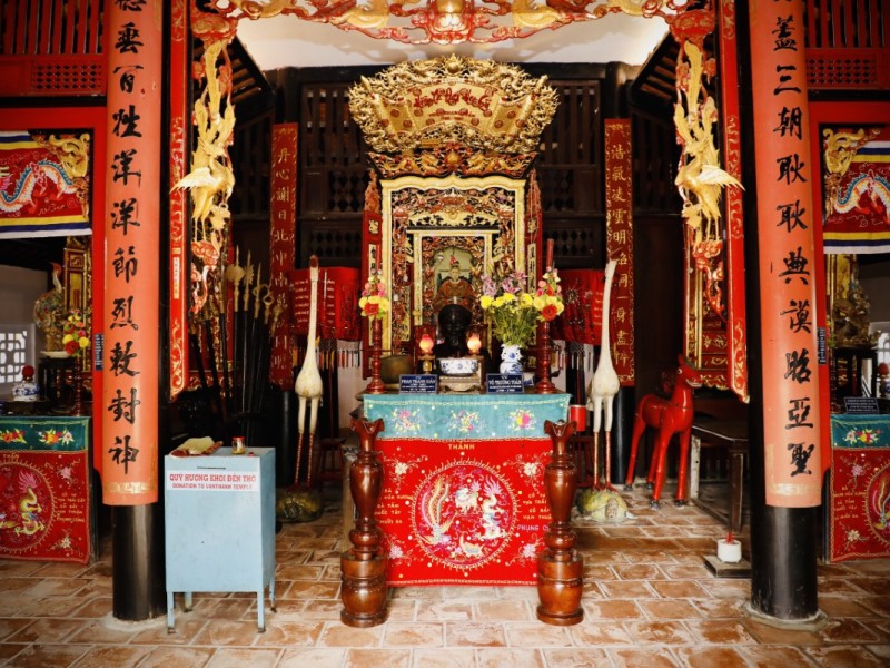 Interior of Vinh Long Temple of Literature showcasing Vietnamese cultural relics