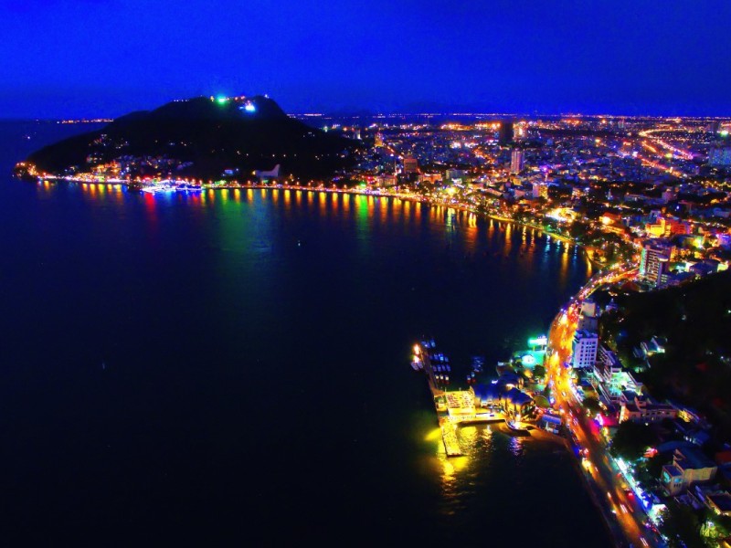 Vung Tau city nightscape with illuminated coastline and bright city lights