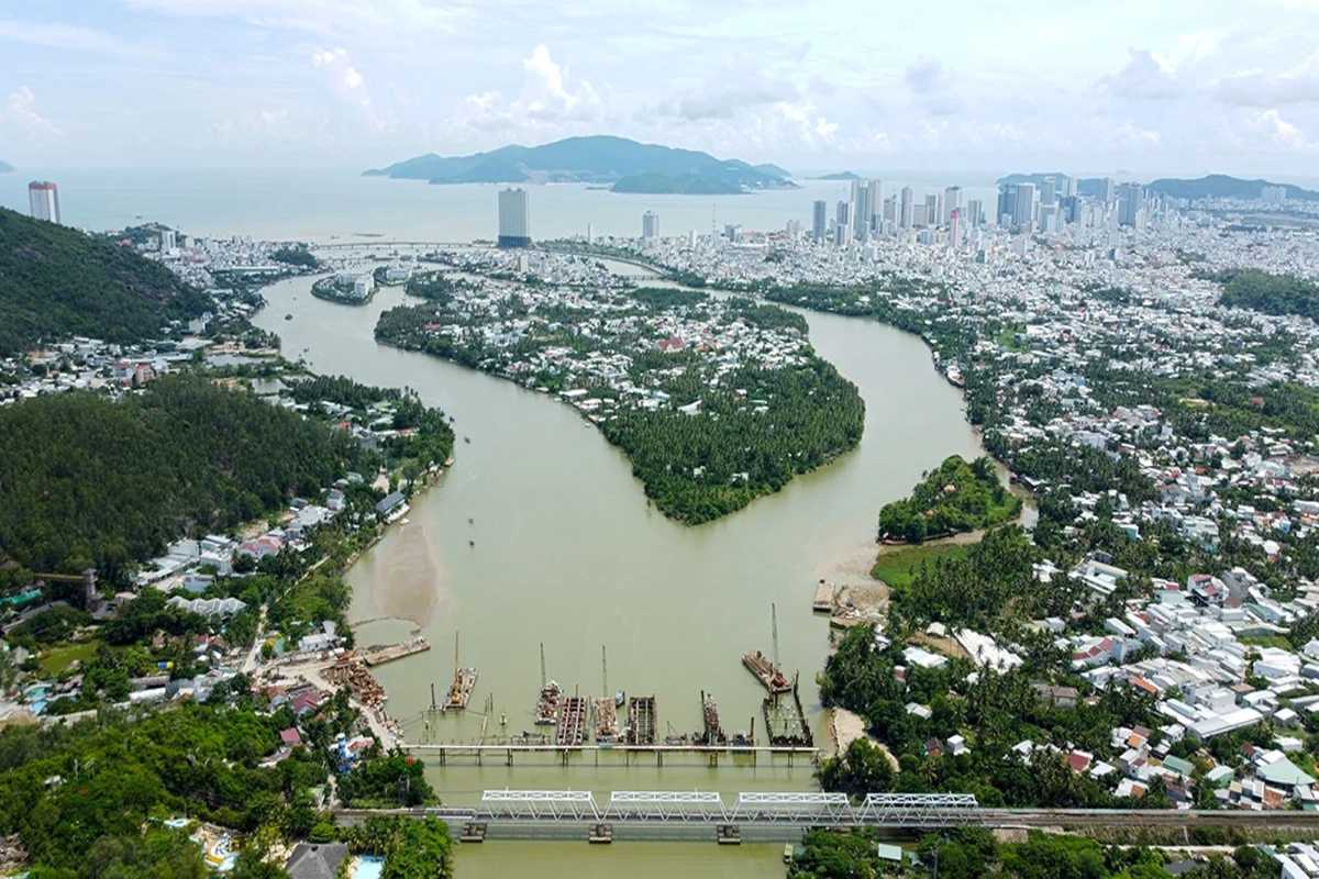 Panoramic shot of Cai River heading toward Nha Trang city and the sea, cutting through green villages